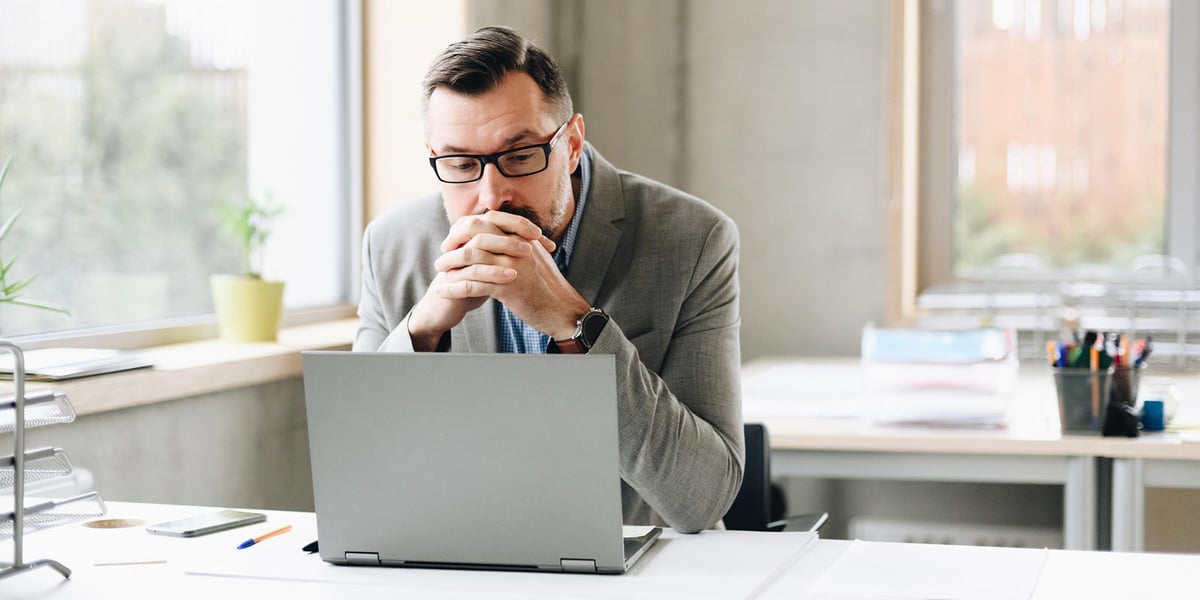 man_thinking_computer_CRM